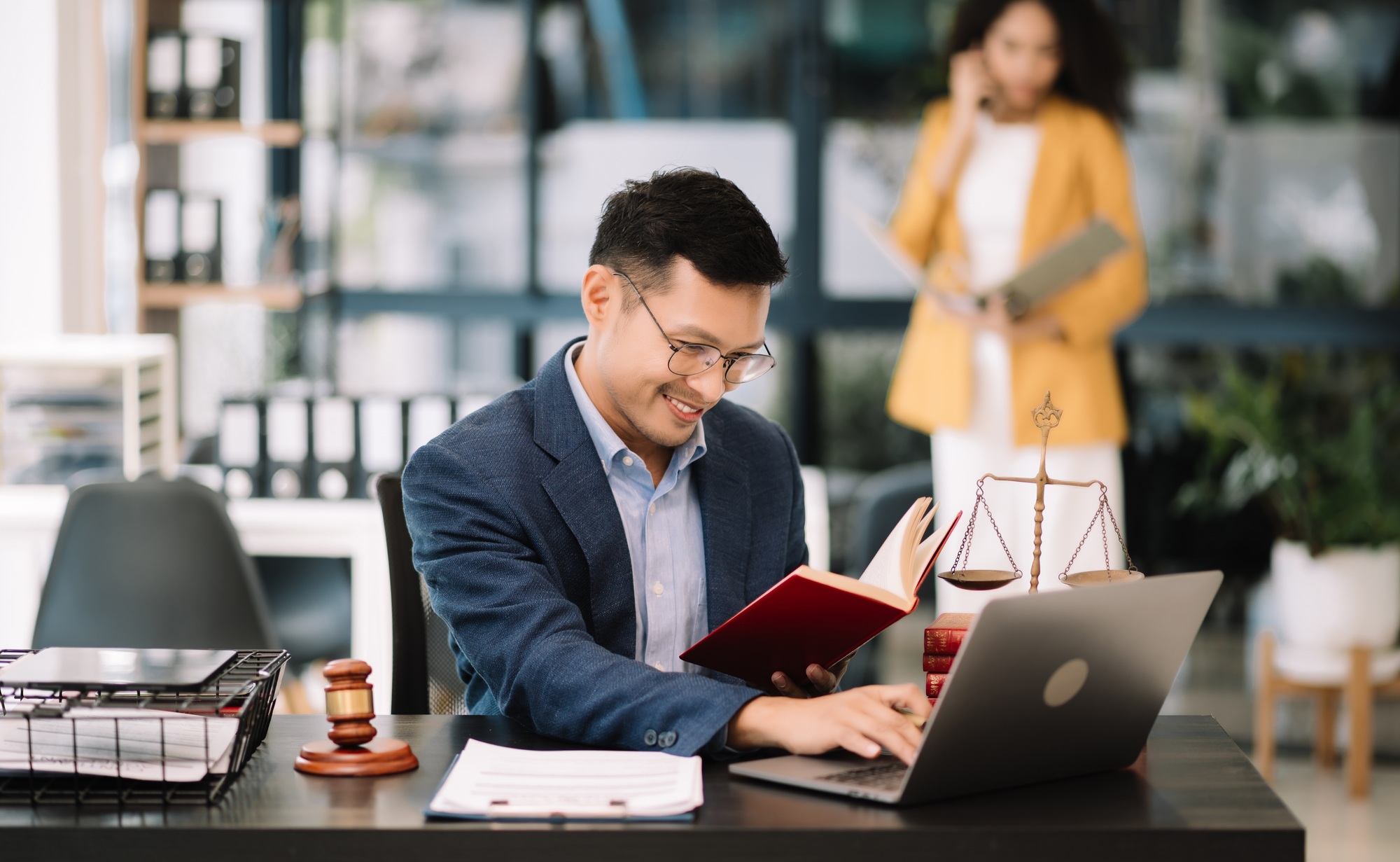 Man lawyer working and gavel, tablet, laptop in front, Advice justice and law concept.